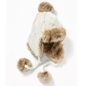 White fur-lined trapper hat, pom poms, ear flaps